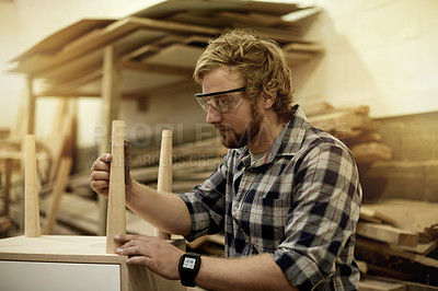 Buy stock photo Carpenter, furniture and man in workshop for assembly, manufacturing and lumber production. Artisan, craftsmanship and carpentry with repair for small business, timber and building or restoration