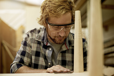 Buy stock photo Woodwork, sanding and man in small business for production, carpentry or manufacturing. Workshop, building chair and creative carpenter in warehouse for craft skills, industrial trade or manual labor
