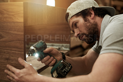 Buy stock photo Drill, carpenter and man in factory with woodwork, restoration and building furniture. Handyman tools, craftsman and person in workshop for cabinet making, manufacturing or industrial production