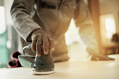 Buy stock photo Carpenter, hands or man in wood workshop with orbital sander, flare or board for home renovation. Person, worker or machine on surface with tool, repair or DIY project in construction warehouse.