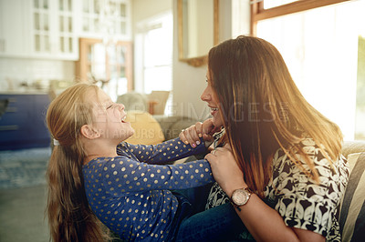 Buy stock photo Happy, mother and play with child on sofa for love, affection and funny games for weekend break. Smile, woman and embrace with kid balance for fun activity family bonding and parent support at house