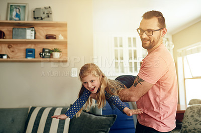 Buy stock photo Relax, dad and child in house with flying game, bonding or freedom in living room for wellness. Lift, family and happiness in apartment with trust, support or playing in parenting with love and care