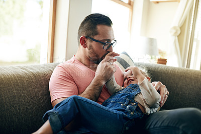 Buy stock photo Father, child and kiss hand for love, support and connection with girl in family home. Sofa, dad and bonding with toddler for care, safety and happy daughter with parent for trust in living room