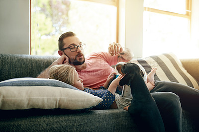 Buy stock photo Relax, father and child in living room with dog, bonding and tablet for streaming video on internet. Weekend, people and animal in home with tech, mobile app and watching cartoon in childhood