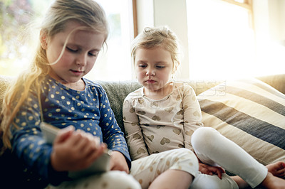 Buy stock photo Tablet, relax and children on sofa in house for playing educational game on app for learning. Digital technology, bonding and girl kids with online entertainment together in living room at home.