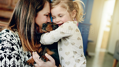 Buy stock photo Love, dog and mother with daughter in home for bonding, support and animal care. Happiness, loyalty and pet owner with woman and child with puppy in family house for trust, security and smile