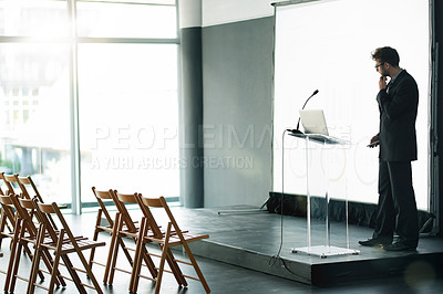 Buy stock photo Businessman, thinking and preparation with presentation on podium for workshop training on space. Thoughtful, man or speaker getting ready with laptop or projector for staff convention in workplace