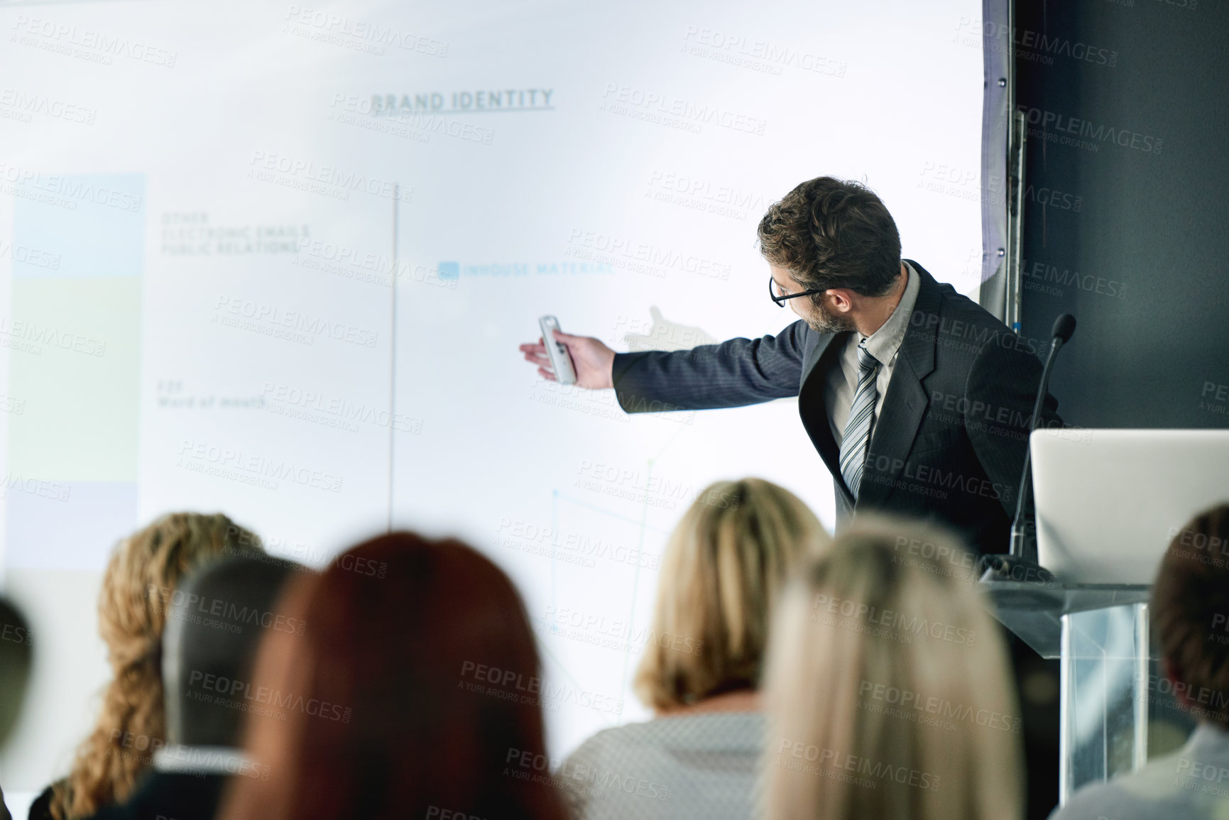 Buy stock photo Seminar, speaker and man with group, pointing or training session with info, brand identity and web. Online, presentation and project manager with remote for marketing strategy, people and workshop