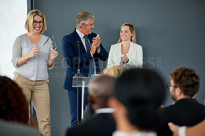 Buy stock photo Happy, business people or applause with award or trophy on podium for congratulations in workshop. Excited group, employees or team clapping with smile for reward, nomination or promotion in ceremony