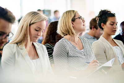 Buy stock photo Audience, business women and notes at seminar for presentation, team training or attention. Conference, convention and worker writing in notebook at company workshop for planning, insight or learning