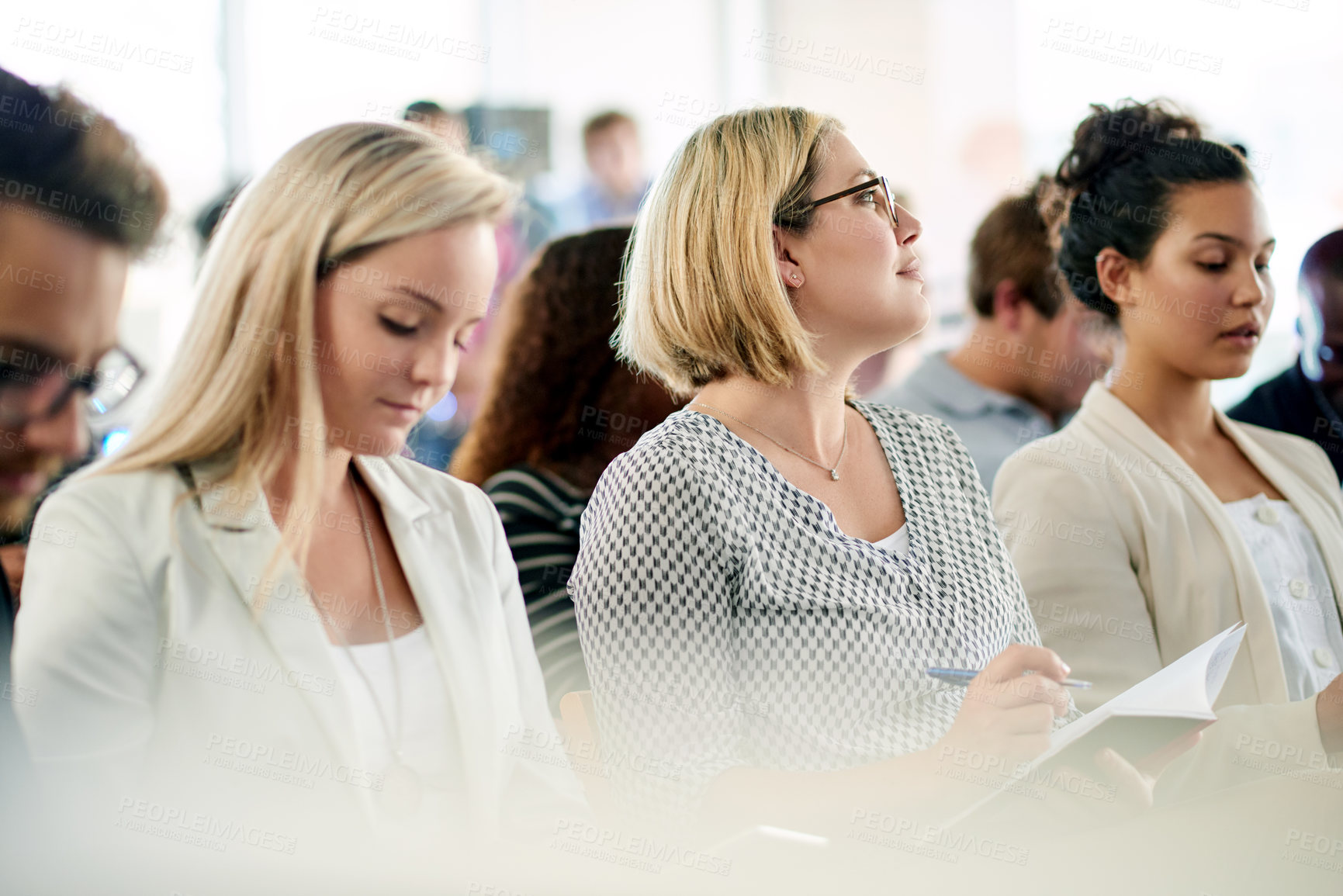 Buy stock photo Audience, business women and notes at seminar for presentation, team training or attention. Conference, convention and worker writing in notebook at company workshop for planning, insight or learning