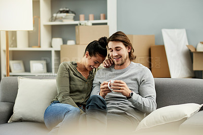 Buy stock photo Coffee, laughing and relax with couple on sofa in living room of new home together for investment. Boxes, drink and moving day with funny people in apartment for finance, growth or property mortgage