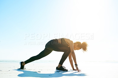 Buy stock photo Fitness, exercise and woman with stretching on beach to start running, cardio practice or wellness. Mockup space, athlete or leg warm up on seashore for workout preparation, getting ready or training