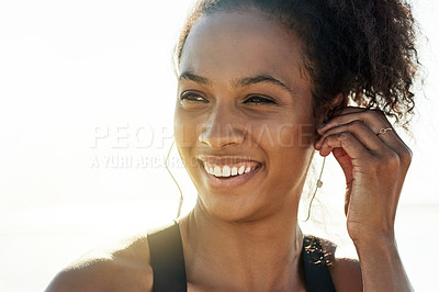 Buy stock photo Fitness, outdoor and woman with earphones, smile and confidence with wellness, audio and pride. Healthy, athlete and happy person with exercise, sound and listening to music, training and workout
