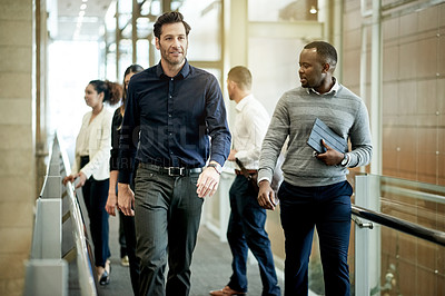 Buy stock photo Businessman, walk and team at office with discussion, review and listen at insurance agency. People, financial advisor and conversation with partner, feedback and planning at risk management company