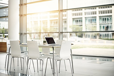 Buy stock photo Empty office, laptop on table and meeting room in company for seminar, conference and planning. Notebook, documents and technology in business for finance management, training and workshop interior