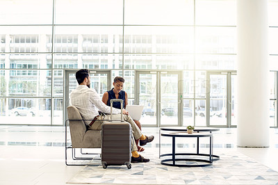 Buy stock photo Laptop, travel and meeting with business people in airport lobby for teamwork, suitcase and networking. Conference trip, collaboration and luggage with employees for layover and flight schedule