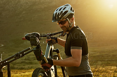 Buy stock photo Fitness, athlete and man with bicycle, nature and preparing for competition, adventure and wellness. Healthy, cyclist or person with helmet with bike rack, safety and eco friendly transport to travel