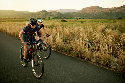 Buy stock photo Athlete, people and cycling on bike in road for pace training, sport fitness and race challenge. Cyclist, safety and team riding on bicycle in nature for cardio exercise, endurance workout and energy