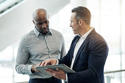 Buy stock photo Business, men and discussion with tablet in office for finance analysis, forecasting or explain report. Financial manager, employees and digital statement for dividend policy review or budget insight