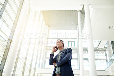 Buy stock photo Man, phone call and talk for real estate deal in lobby, low angle and contact for negotiation. Person, realtor and smartphone with discussion for property portfolio expansion, investing or agreement