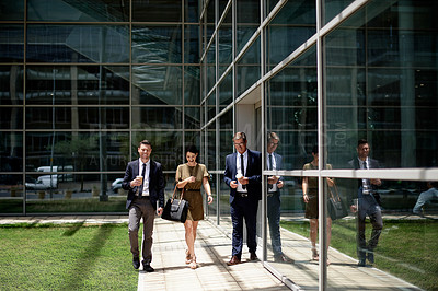 Buy stock photo Laughing, outdoor and business people by glass office, conversation and happy commute to work. Smile, colleagues or travel to workplace with discussion, friendship and commitment in corporate career.
