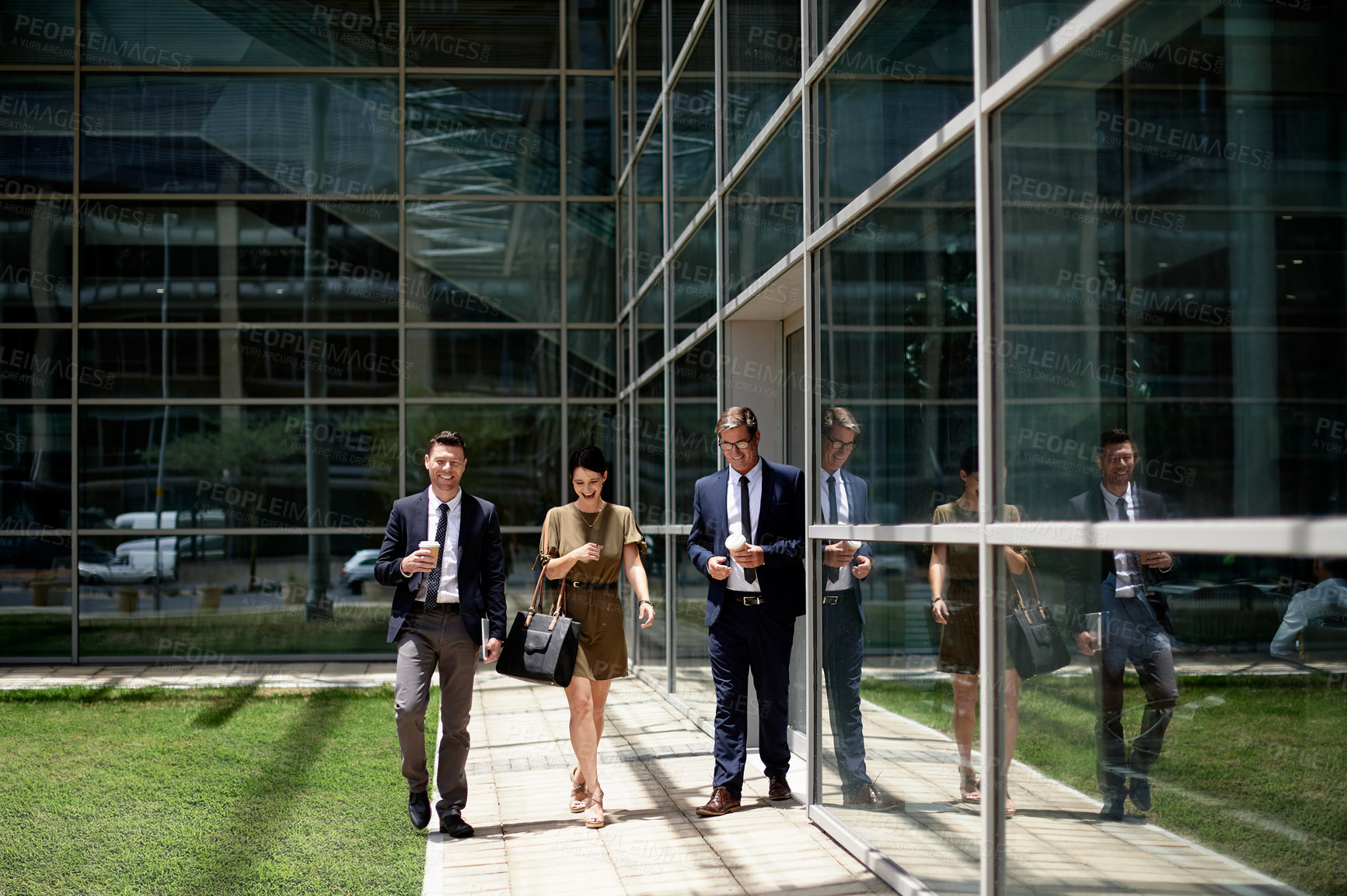 Buy stock photo Laughing, outdoor and business people by glass office, conversation and happy commute to work. Smile, colleagues or travel to workplace with discussion, friendship and commitment in corporate career.