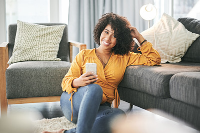 Buy stock photo Portrait, home and woman with smartphone, smile and message to contact, internet and texting. Apartment, cellphone and person on floor, happiness and connection with communication and social media