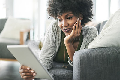 Buy stock photo Tablet, relax and reading with black woman on sofa for social media, connection and communication. Online, networking app and streaming with person in living room of home for digital post and scroll