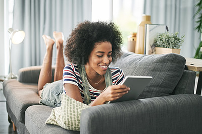 Buy stock photo Happy, home and black woman on couch, tablet or texting with social media, email and relax. Smile, chatting or African person with tech, app or internet with connection, subscription or communication