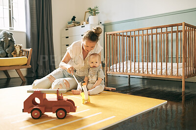 Buy stock photo Baby, toys and mother play in home, having fun and learning, relax or bonding. Development, care and mama with kid, newborn or toddler playing with penguin and enjoying time together in nursery.