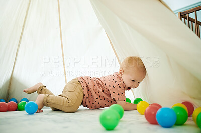 Buy stock photo Baby, child and playing with toys in home bedroom with a tent for fun and growth development. Male toddler or kid with color balls for learning, education or game for happiness and creativity