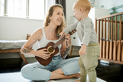 Buy stock photo Mother, child and playing guitar for music, learning and education in a nursery or home bedroom. Woman and a toddler kid together for love, care and quality time while happy, bonding and singing