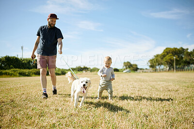 Buy stock photo Family, baby and father walking the dog in field for exercise, freedom and adventure in countryside. Childhood, pets and happy boy and dad outdoors relaxing on holiday, summer vacation and weekend