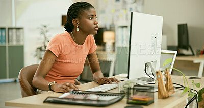 Buy stock photo Computer, reading and young black woman in the office doing research for creative project. Technology, career and professional African female designer working on desktop in the modern workplace.