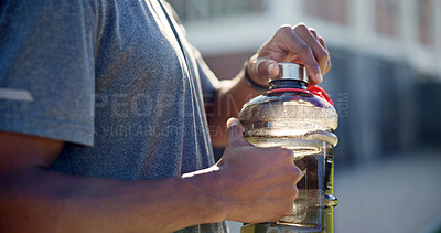 Buy stock photo Man, hands and fitness with water bottle in city for outdoor workout break, hydration or recovery. Active, male person or rest with mineral liquid for sustainability, vitamins or nutrition in town