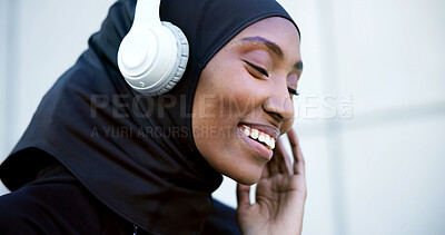 Buy stock photo City, fitness and muslim woman with music, listen to radio or streaming song with happiness. Hijab, athlete and black person with headphones for playlist, podcast and smile on audio break outdoor