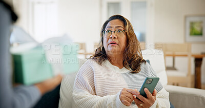 Buy stock photo Shock, gift and senior woman in home with omg reaction for present, surprise visit and parcel. House, retirement and person with phone, wow and unexpected for thank you, package and appreciation