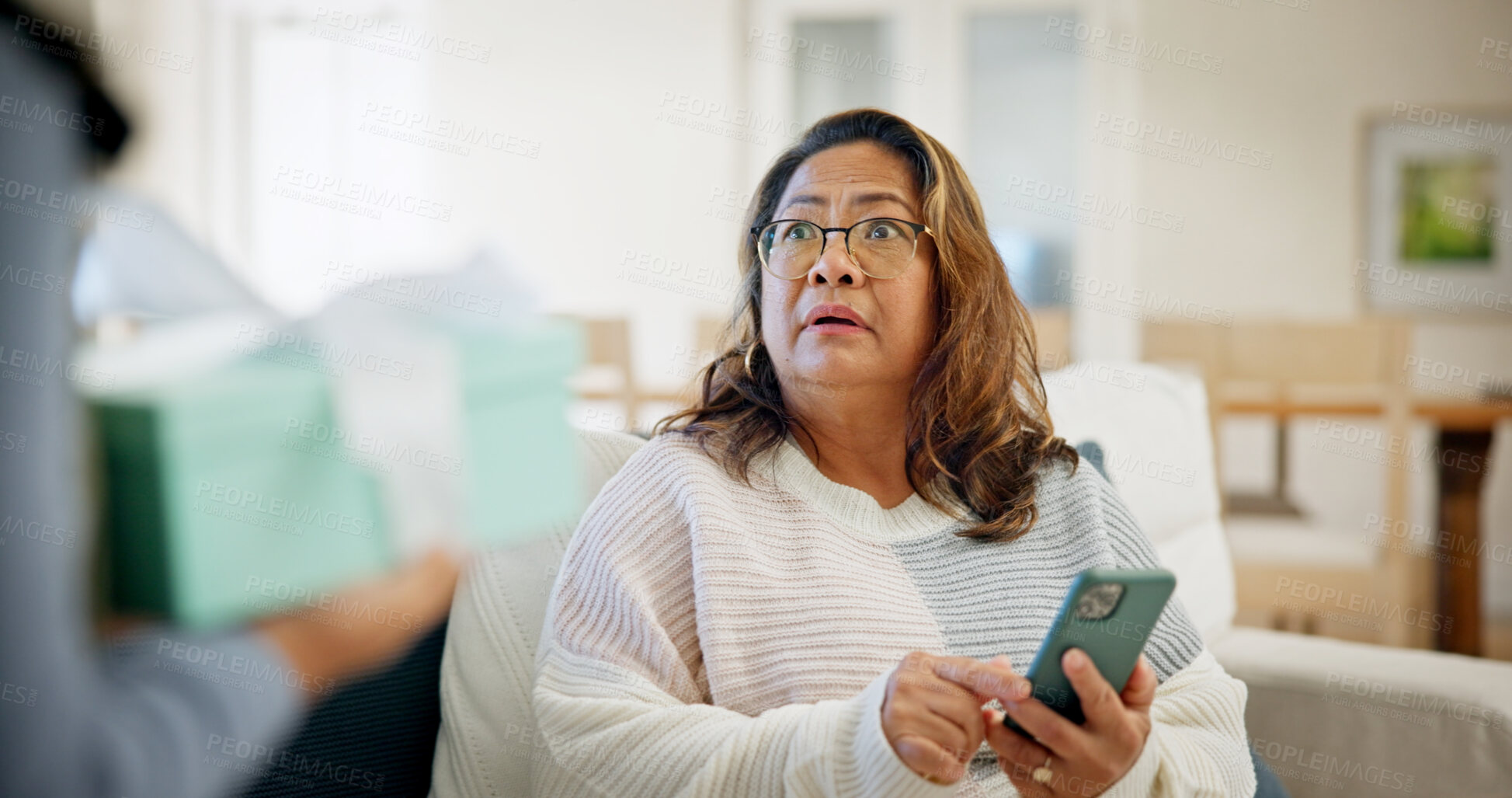 Buy stock photo Shock, gift and senior woman in home with omg reaction for present, surprise visit and parcel. House, retirement and person with phone, wow and unexpected for thank you, package and appreciation