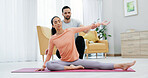 Woman, fitness and yoga with coach in home for private workout, exercise or physical activity. Man, personal trainer or active instructor helping client with stretching, health or wellness in house