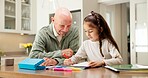 Homework, grandfather and child in kitchen with help, childcare and support with homeschool activity. Education, grandparent and kid with task aid, family guidance and assistance in home learning.