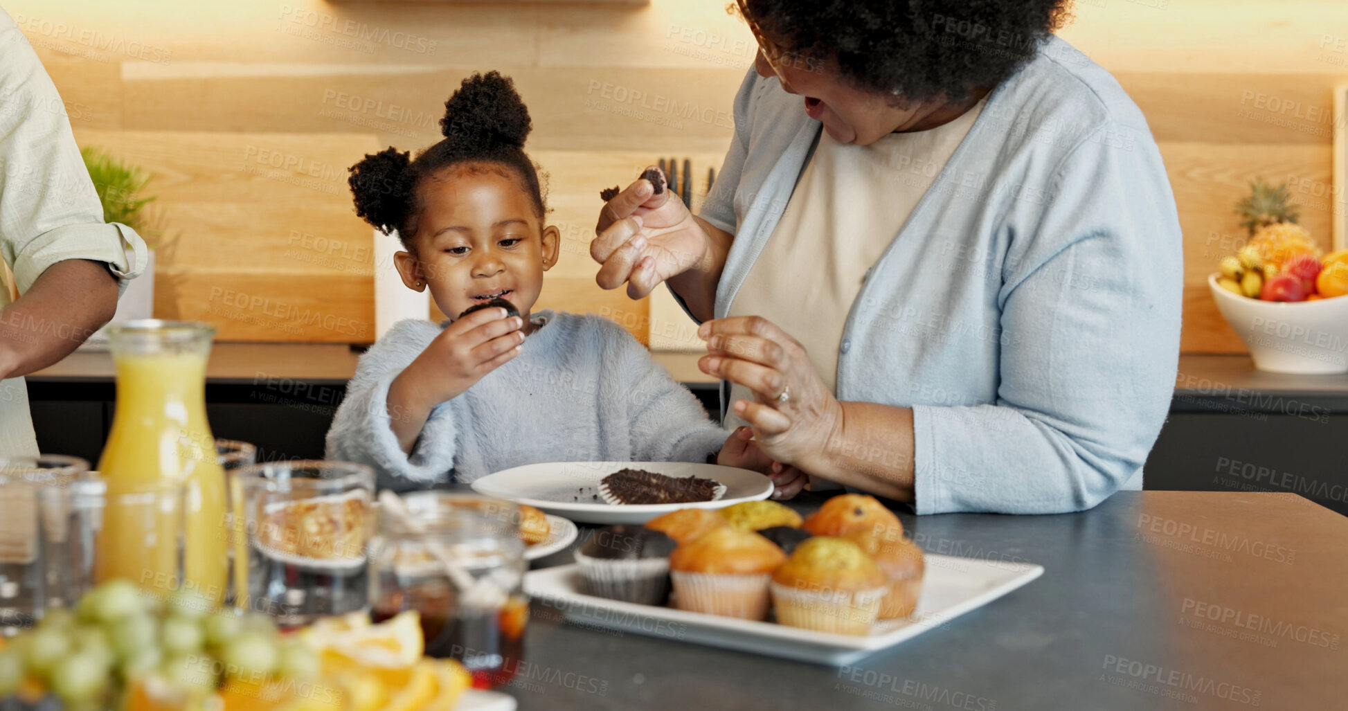 Buy stock photo Breakfast, kitchen and grandma with child for eating, healthy meal and nutrition together in morning. Family, home and African girl with grandmother, muffin and juice for vitamins, care and wellness