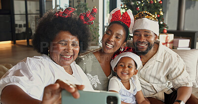 Buy stock photo Christmas, happy and black family with selfie in home for capture moment or festive memory together. Mom, dad and child with grandma or smile for photography, generations or December holiday in house