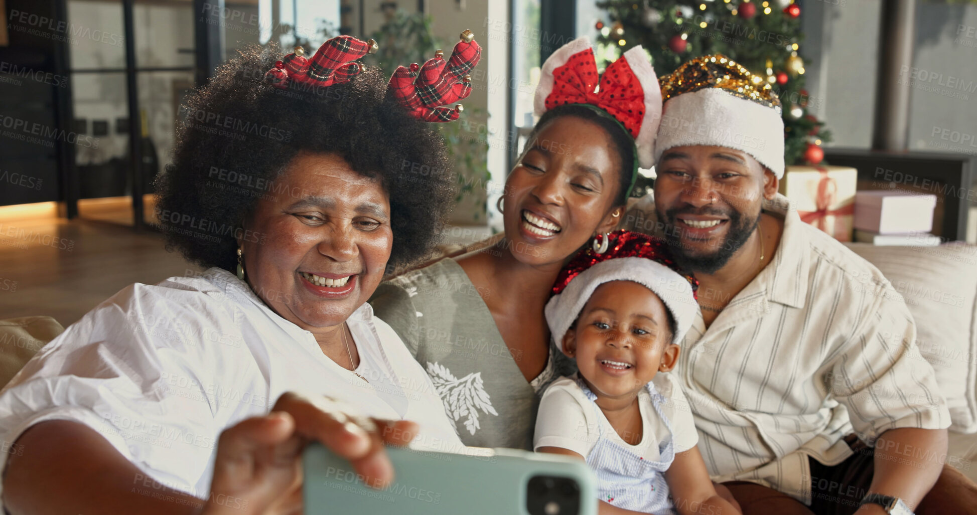 Buy stock photo Christmas, happy and black family with selfie in home for capture moment or festive memory together. Mom, dad and child with grandma or smile for photography, generations or December holiday in house