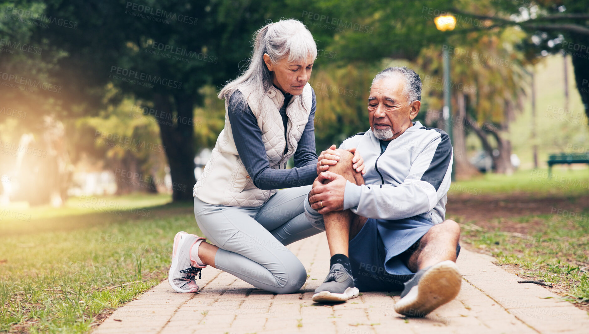 Buy stock photo Knee pain, runner and help with old couple in park for fitness risk, fibromyalgia and accident. Workout injury, training sprain and torn ligament with senior man and woman outdoor for leg check