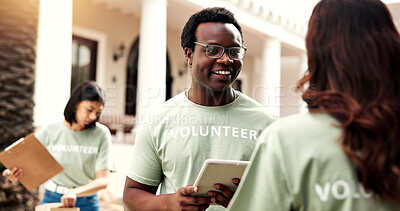 Buy stock photo Man, team and tablet outdoor for volunteering, sign up and assign tasks for community outreach. Smile, coordinator and people with tech for charity, participation and job allocation for distribution