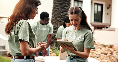 Buy stock photo Woman, volunteer and reading outdoor with tablet, sign up and appoint task for community outreach. Smile, coordinator and people with digital for charity, participation and job allocation for welfare