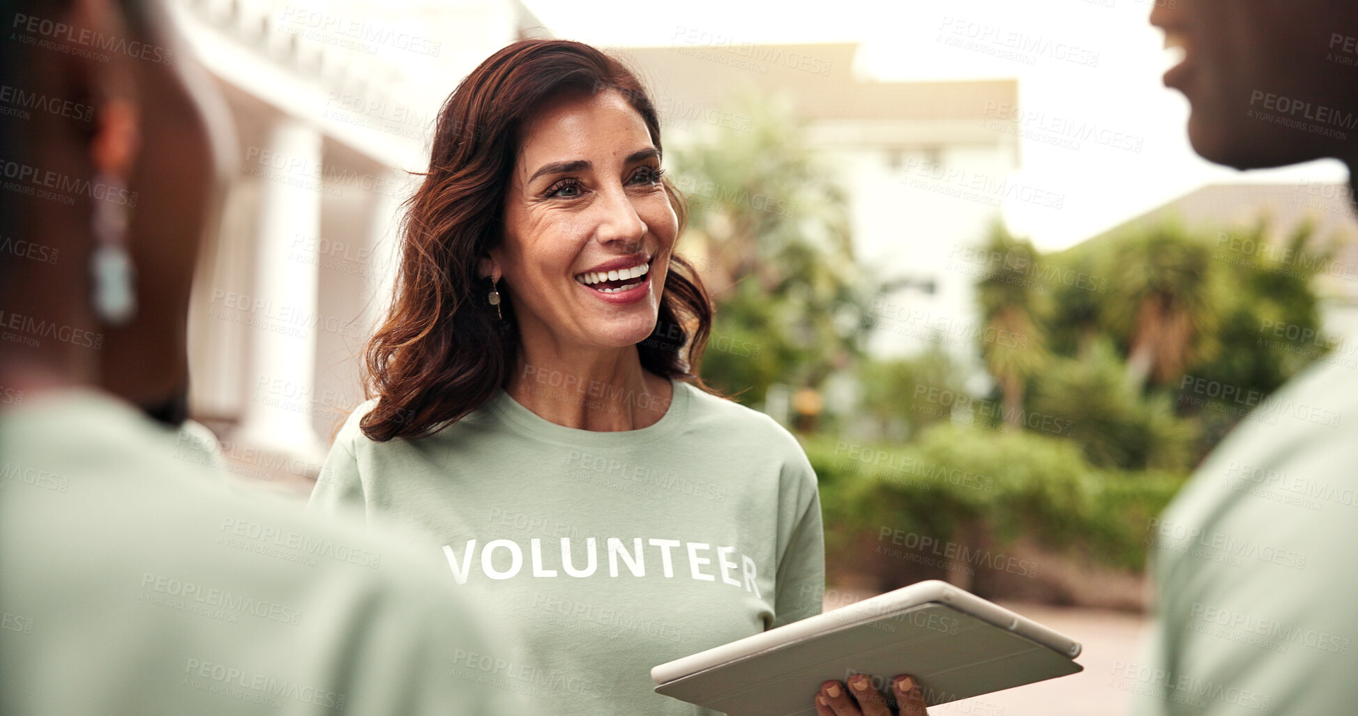Buy stock photo Happy, woman and team with tablet for volunteering, sign up and appoint task of community outreach. Smile, coordinator or people with digital for charity, participation and job allocation for welfare