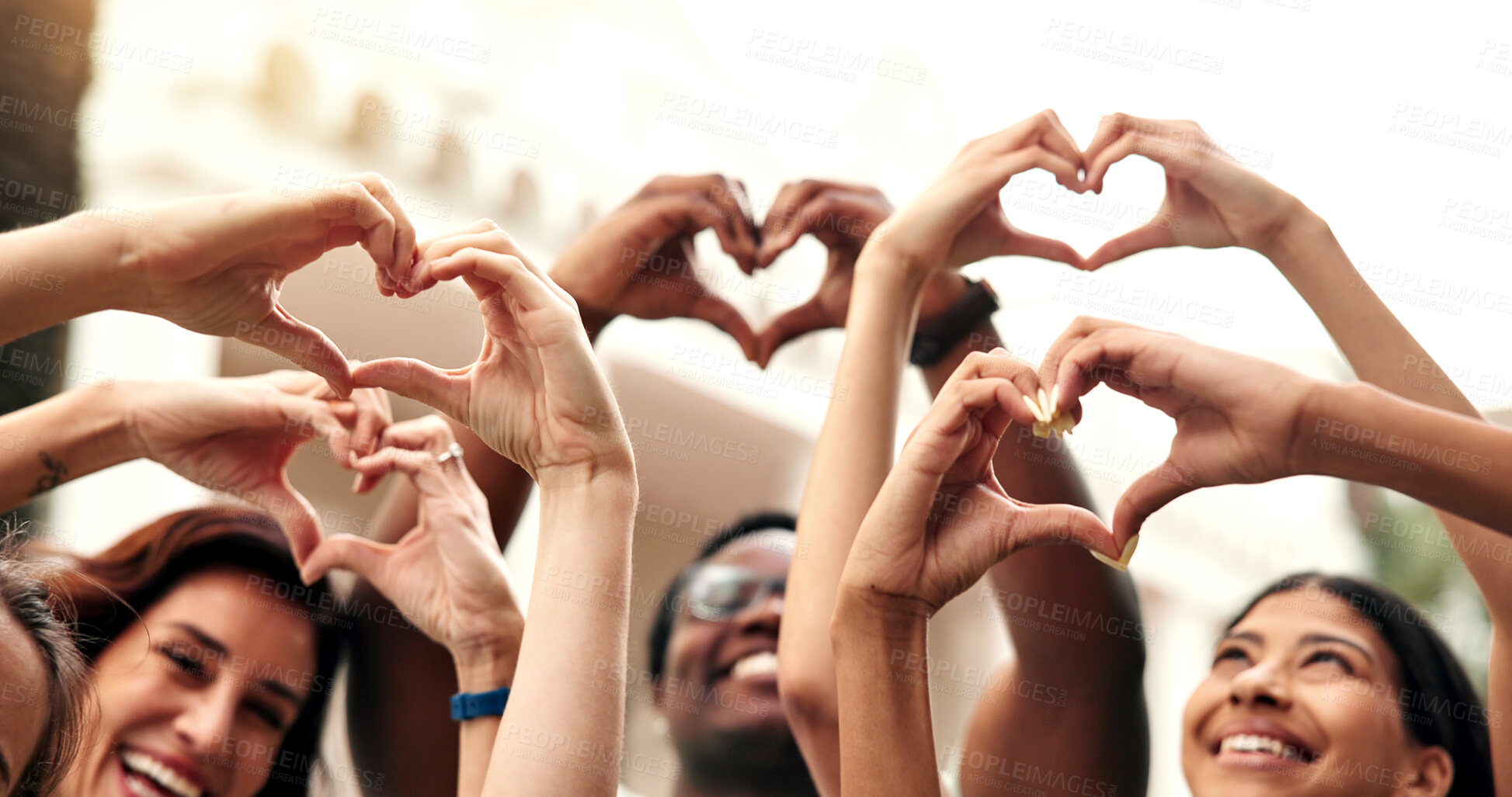 Buy stock photo Friends, students and hands at campus with heart, new semester and motivation for education. Portrait, smile or teacher at college with love gesture, acceptance and encourage for learning opportunity