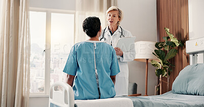 Buy stock photo Doctor, woman and conversation on hospital bed with advice, explain test results and rehabilitation. Medical worker, mature person and talk in clinic with diagnosis, help and guidance for healing.